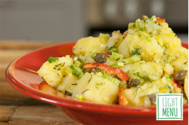 Potato salad with celery, red peppers, capers, mustard, lemon and fresh herbs