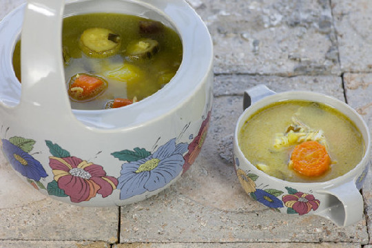 Fish soup with shi drum fillet, suffron, carrot, zucchini, celery and rice
