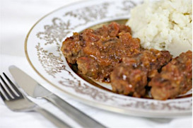 Smyrna soutzoukakia meatballs with fresh tomato, cumin and mashed potatoes