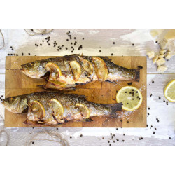 Sea bass with lemon wedges and celeriac puree