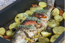 Roasted sea bass with lemon, capers, ginger & baked potatoes