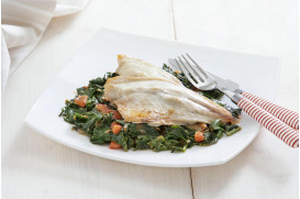 Fresh sea bream filet with spinach in the oven & fresh tomato