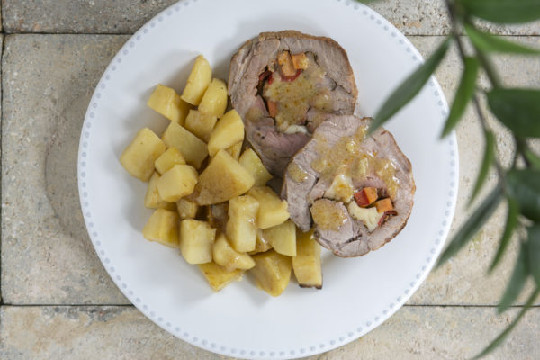 Stuffed pork with graviera cheese, carrots, peppers & roast potatoes