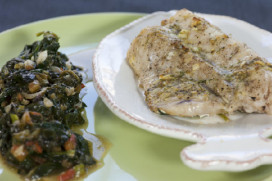 Roast shi drum with spinach, fresh tomatoes and butter with fresh herbs